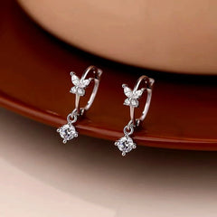 Model showcasing the dangle and style of the Sterling Silver uper Fairy Zircon Butterfly Earrings