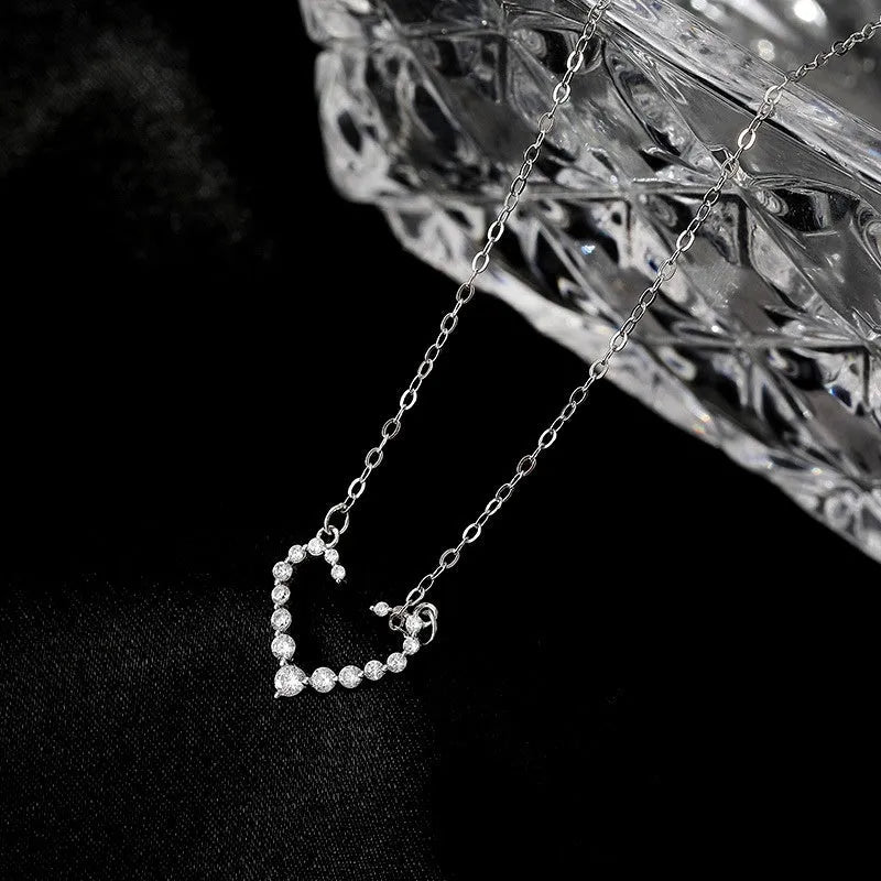 Close-up of the pendant and clasp on the Lucky Clover Necklace