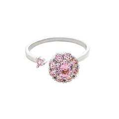 Silver adjustable pink crystal cluster flower ring on white background