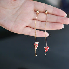 Angled view of the Silver Post Christmas Santa Claus Climbing Earrings