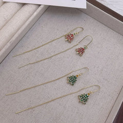 Model showcasing the dangle and style of the 14K Gold Plated Christmas Tree Threader Earrings