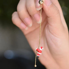 Close-up detail of the sparkling zircons and plating on the Santa Climbing Earrings