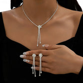 Sparkling silver rhinestone Y-necklace and drop earrings jewelry set on woman