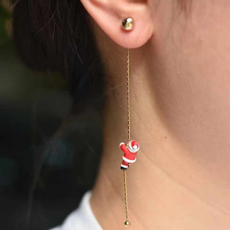 Model showcasing the dangle and style of the Silver Post Christmas Santa Claus Climbing Earrings