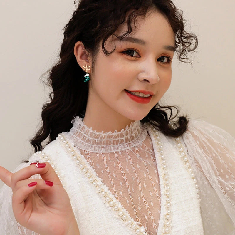 Close-up detail of the sparkling zircons and plating on the Snowflake Tassel Earrings