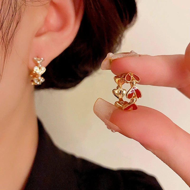 Angled view of the 14K Gold-Plated Elegant Heart-Shaped Oil-Drop Earrings