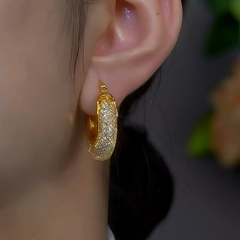 Close-up detail of the sparkling zircons and plating on the Mesh Crystal Earrings