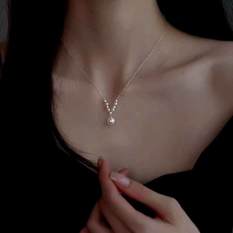 Detailed view of the Sterling Silver V-Shaped Artificial Pearl Necklaces chain and pendant