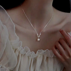 Sterling Silver V-Shaped Artificial Pearl Necklaces worn to showcase its length and pendant detail