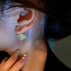 Model showcasing the dangle and style of the 14K Gold-Plated Diamond Cat's Eye Ball Jacket Earrings