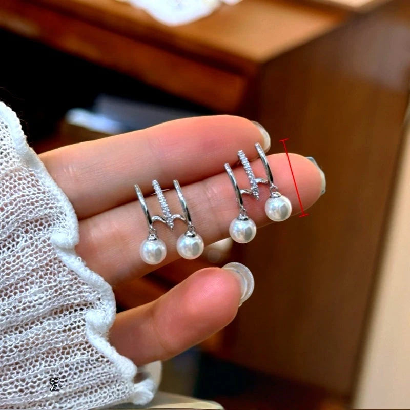 Angled view of the 14K Gold-Plated Elegant Multi-Layer Pearl Earrings