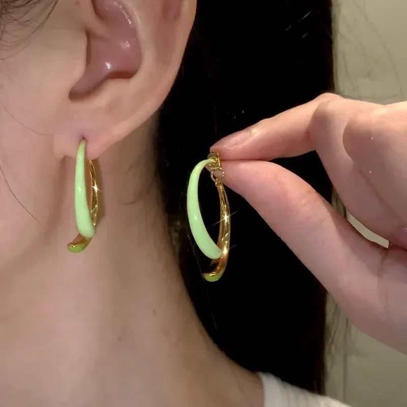 Close-up detail of the sparkling zircons and plating on the Fishtail Earrings