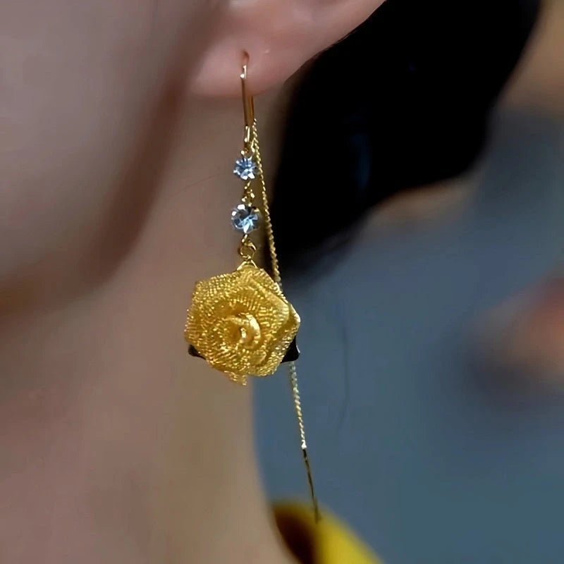 Model showcasing the dangle and style of the 14K Gold-Plated Elegant Zircon Rose Threader Tassel Earrings