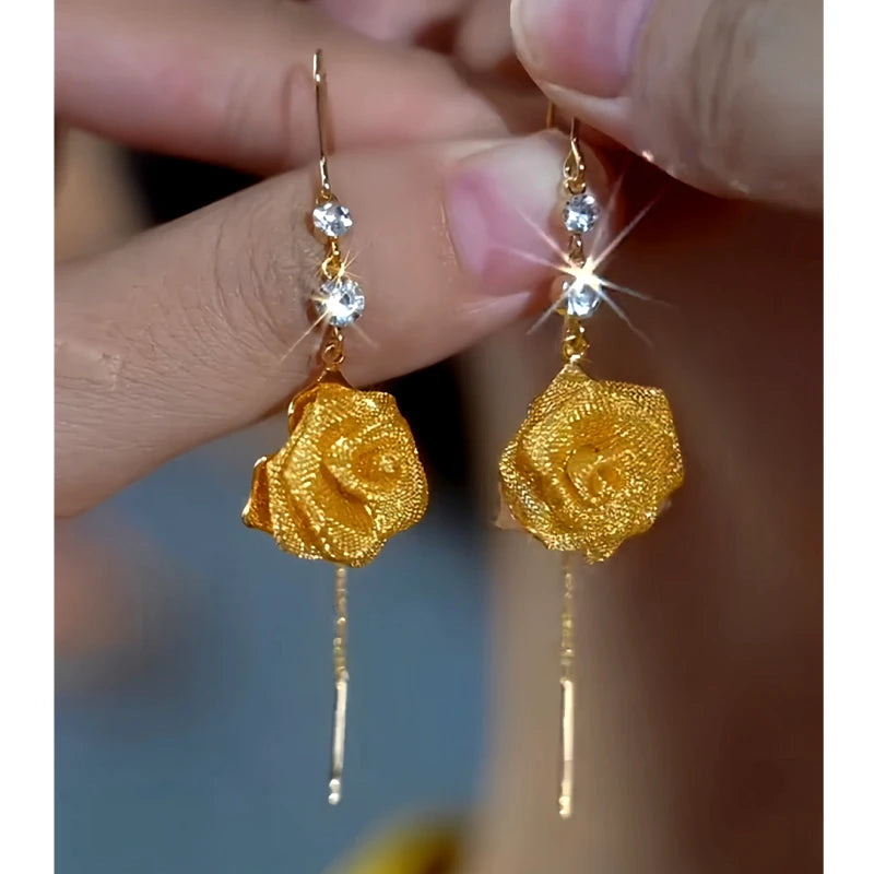 Angled view of the 14K Gold-Plated Elegant Zircon Rose Threader Tassel Earrings