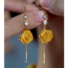 Angled view of the 14K Gold-Plated Elegant Zircon Rose Threader Tassel Earrings