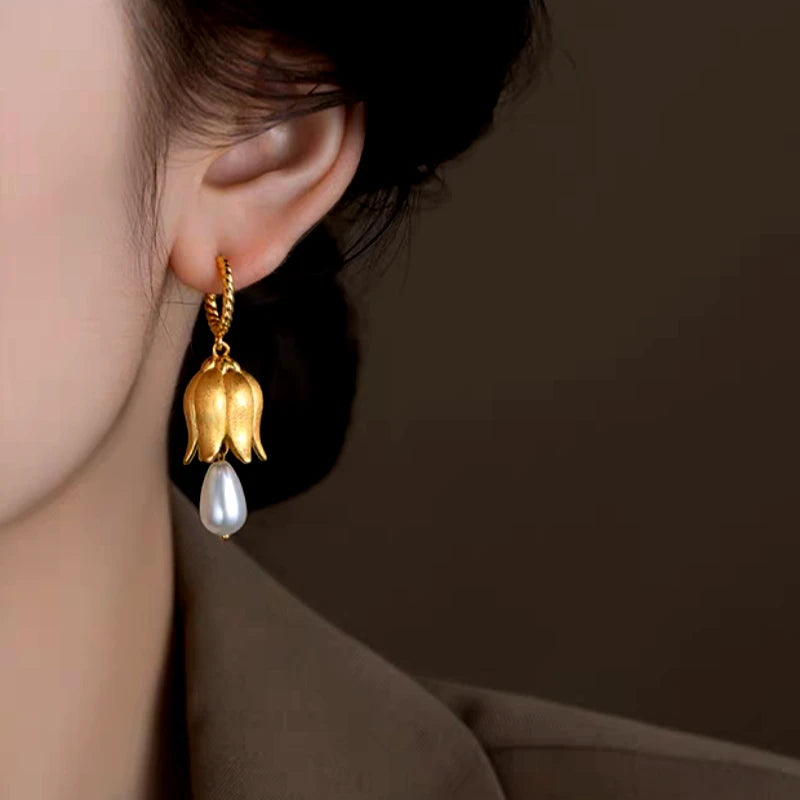 Close-up detail of the sparkling zircons and plating on the Lily Pearl Earrings