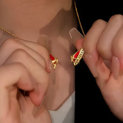 Detailed view of the 14K Gold-Plated Magnetic Red Butterfly Necklace chain and pendant
