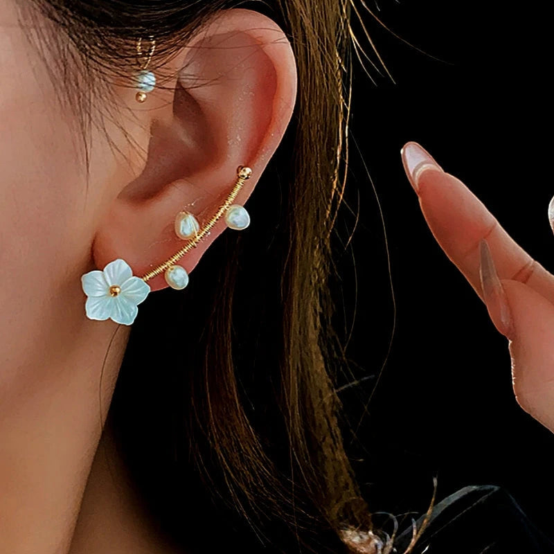 Close-up detail of the sparkling zircons and plating on the Pearl Ear Cuffs