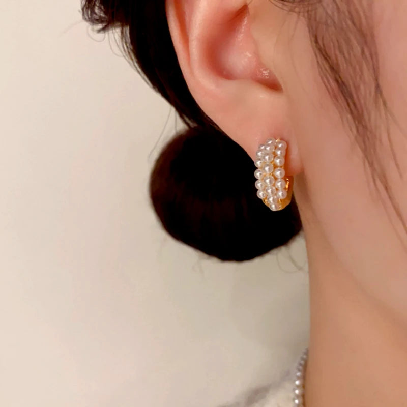 Close-up detail of the sparkling zircons and plating on the Pearl C-Shaped Earrings