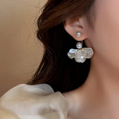 Close-up detail of the sparkling zircons and plating on the Pearl Petal Earrings