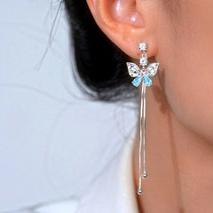 Close-up detail of the sparkling zircons and plating on the Blue Butterfly Tassel Earrings