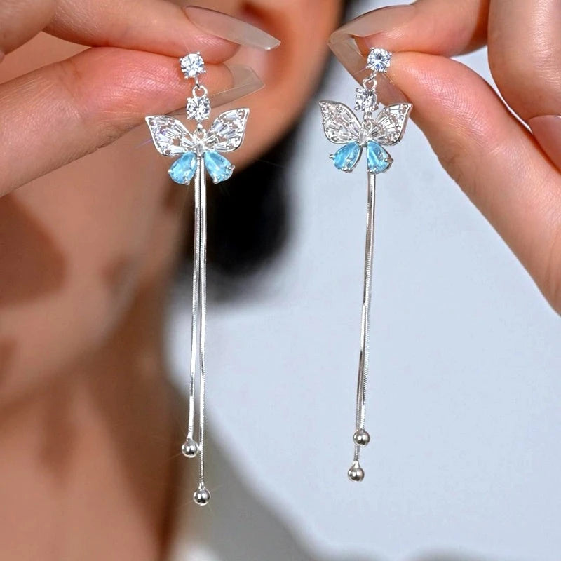 Angled view of the 14K Gold-Plated Elegant Zircon Butterlfy Tassel Earrings