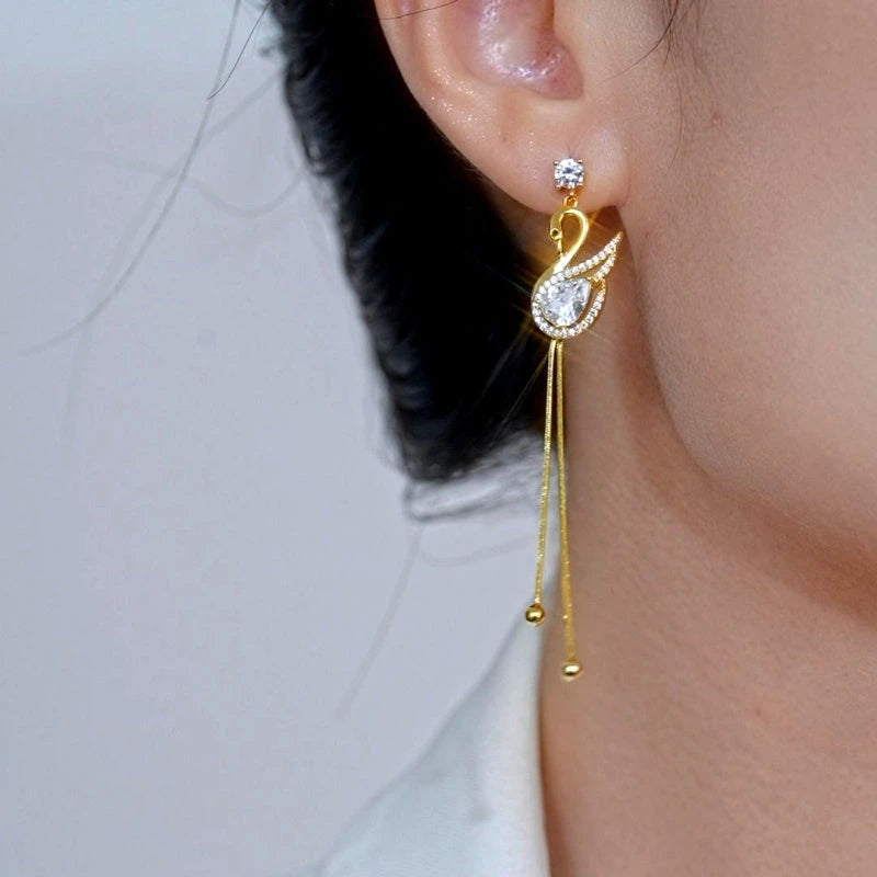 Close-up detail of the sparkling zircons and plating on the Swan Tassel Earrings