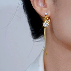 Close-up detail of the sparkling zircons and plating on the Swan Tassel Earrings