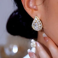 Model showcasing the dangle and style of the 14K Gold-Plated Elegant Zircon Diamond Water Drop Earrings