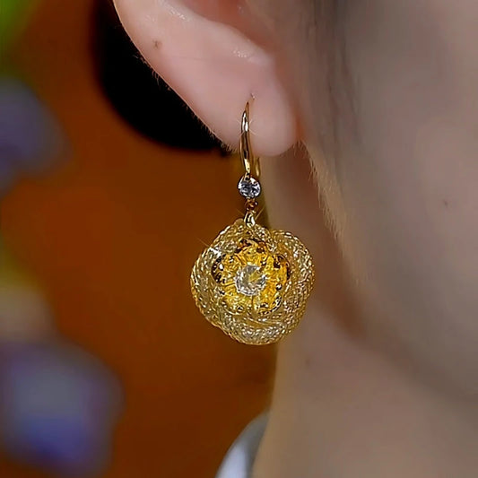 Model showcasing the dangle and style of the 14K Gold-Plated Luxury Diamond Mesh Rose Ear Hook Earrings