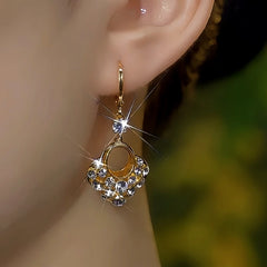 Close-up detail of the sparkling zircons and plating on the Shiny Diamond Earrings