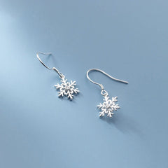 Close-up detail of the sparkling zircons and plating on the Snowflake Ear Hooks