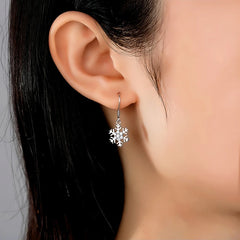 Model showcasing the dangle and style of the Sterling Silver Christmas Diamond Snowflake Ear Hook Earrings