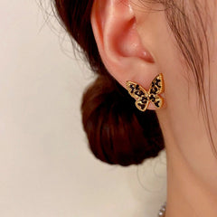 Close-up detail of the sparkling zircons and plating on the Butterfly Stud Earrings