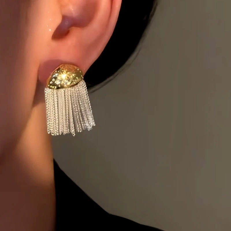 Model showcasing the dangle and style of the 14K Gold-Plated Luxury Decorative Tassel Earrings