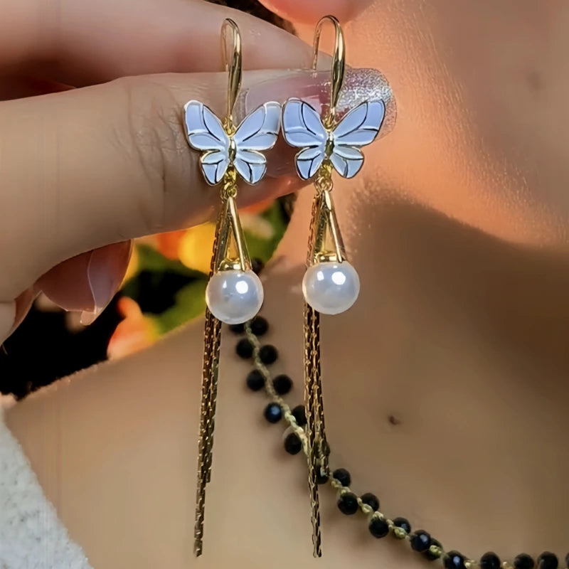 Angled view of the 14K Gold-Pated Butterfly Pearl Ear Hooks