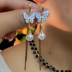Angled view of the 14K Gold-Pated Butterfly Pearl Ear Hooks