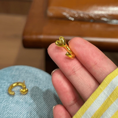 Angled view of the 14K Gold-Pated Heart-Design Jacket Earrings