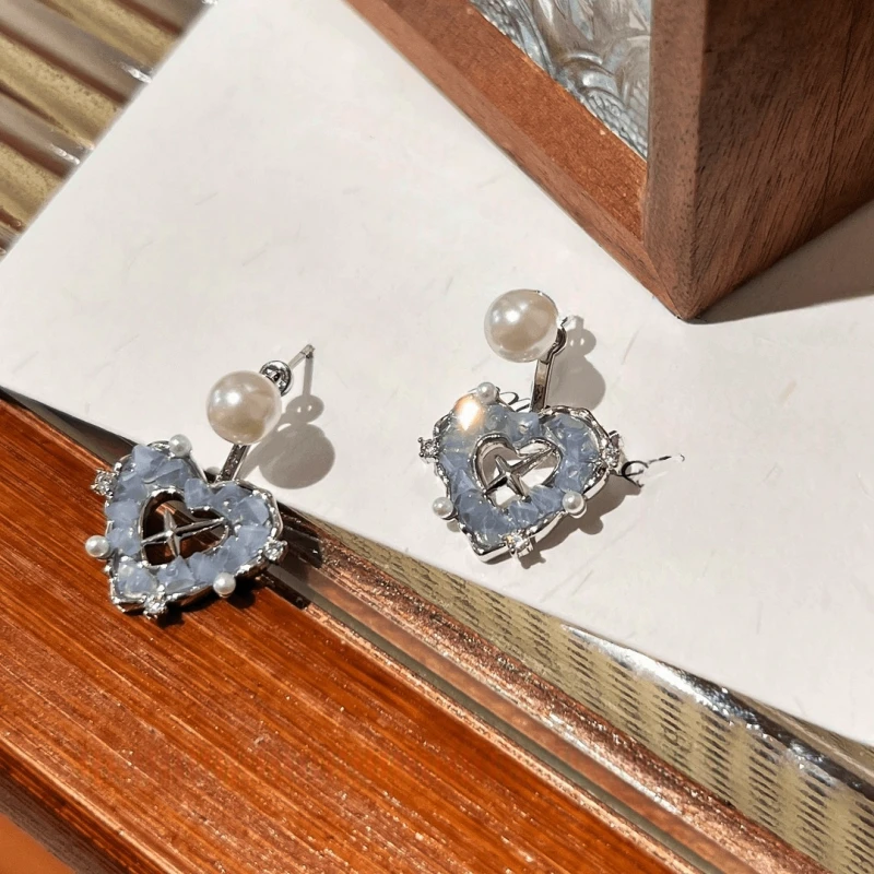 Angled view of the 14K Gold-Pated Heart-Design Pearl Jacket Earrings