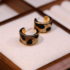 Angled view of the 14K Gold-Pated Leopard Print C-Shaped Hoop Earrings