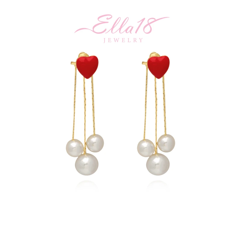 Angled view of the 14K Gold-Pated Red Heart Bead Tassel Earrings