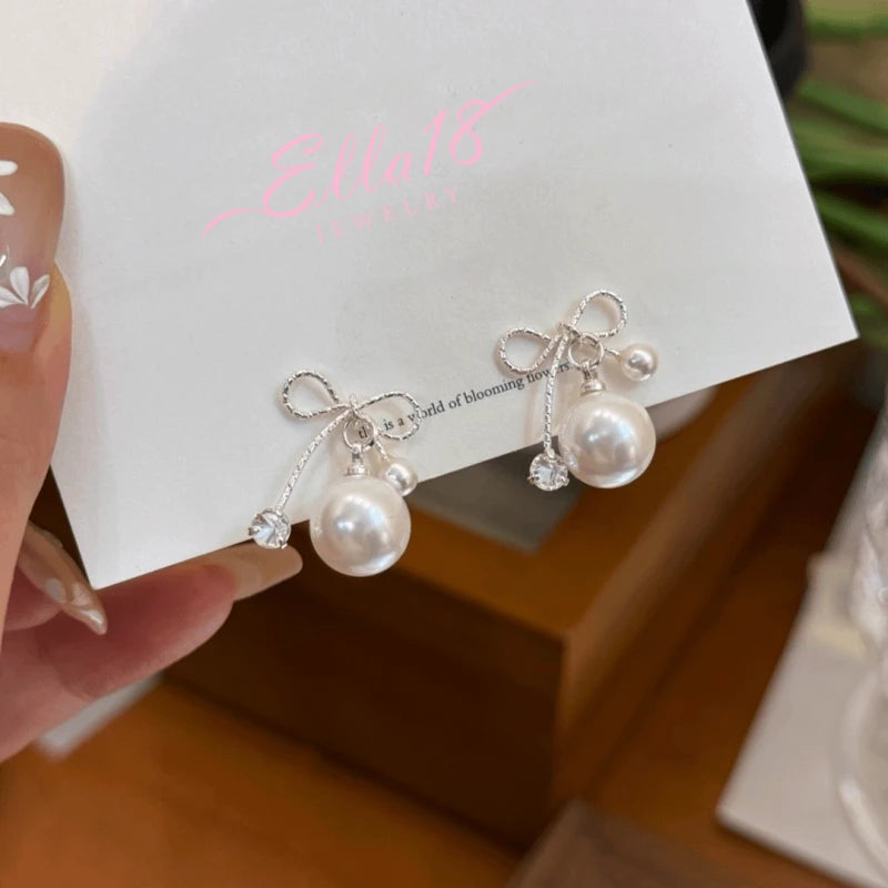 Angled view of the 14K Gold-Pated Zircon Bow Bead Earrings