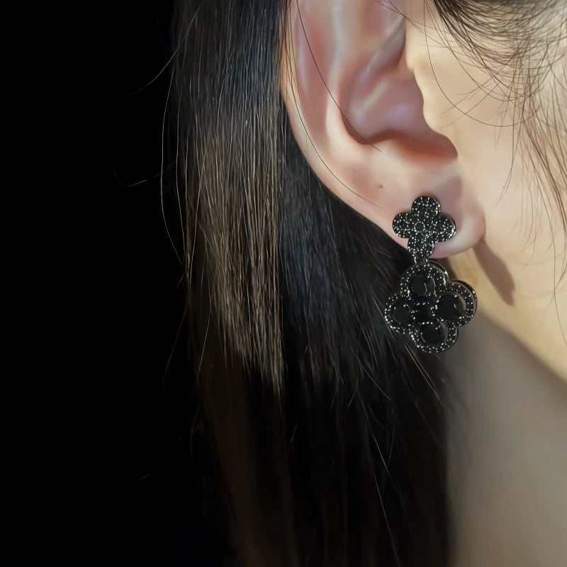 Model showcasing the dangle and style of the 14K Gold-Pated Zircon Four-Leaf Clover Earrings