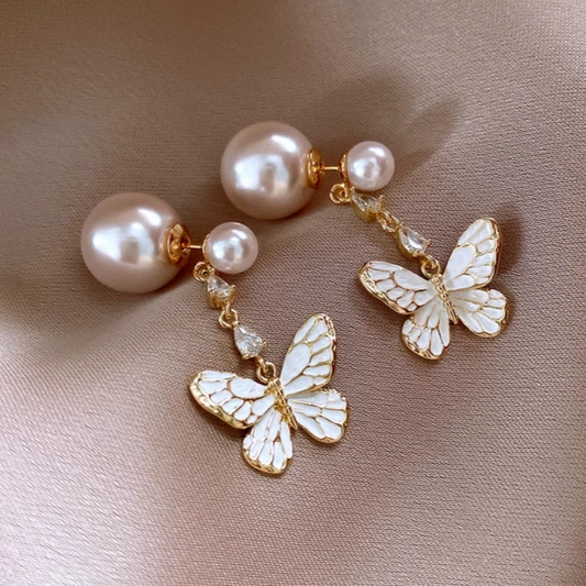 Model showcasing the dangle and style of the 14K Gold-Plated 2025 Elegant Butterfly Pearl Earrings