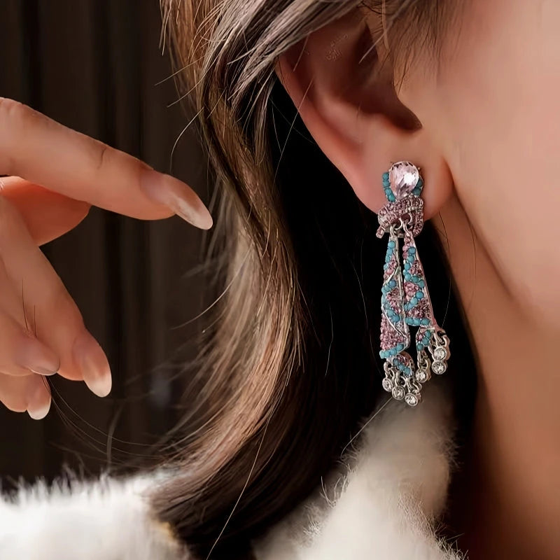 Angled view of the 14K Gold-Plated 2025 Elegant Diamond-Studded Tassel Earrings