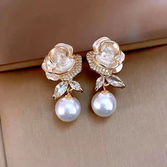 Model showcasing the dangle and style of the 14K Gold-Plated 2025 Elegant French Drip Glaze Camellia Pearl Earrings