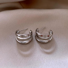 Angled view of the 14K Gold-Plated 2025 Elegant Multi-Layer C-Shaped Earrings