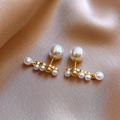 Angled view of the 14K Gold-Plated 2025 Elegant Pearl Earrings