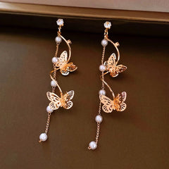 Angled view of the 14K Gold-Plated 2025 Elegant Zircon Butterfly Pearl Tassel Earrings