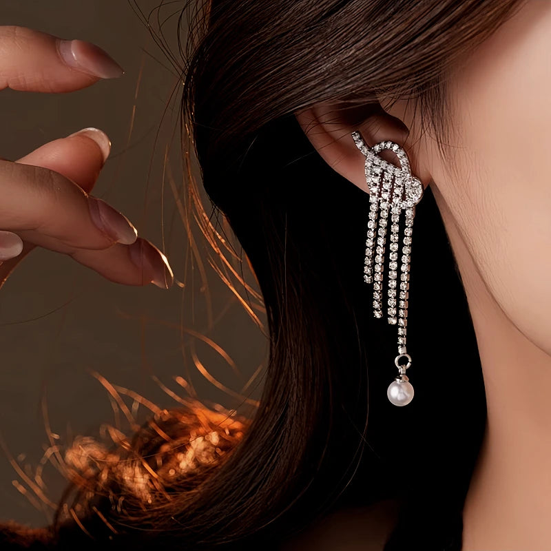 Angled view of the 14K Gold-Plated 2025 Elegant Zircon Diamond Knotted Pearl Tassel Earrings
